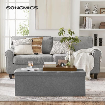 SONGMICS MAZIE Collection - 43 Inches Folding Storage Ottoman Bench, Ottoman Foot Rest, End of Bed Bench, Storage Chest, Load 660 lb, for Living Room, Bedroom, Entryway, Light Gray ULSF77G