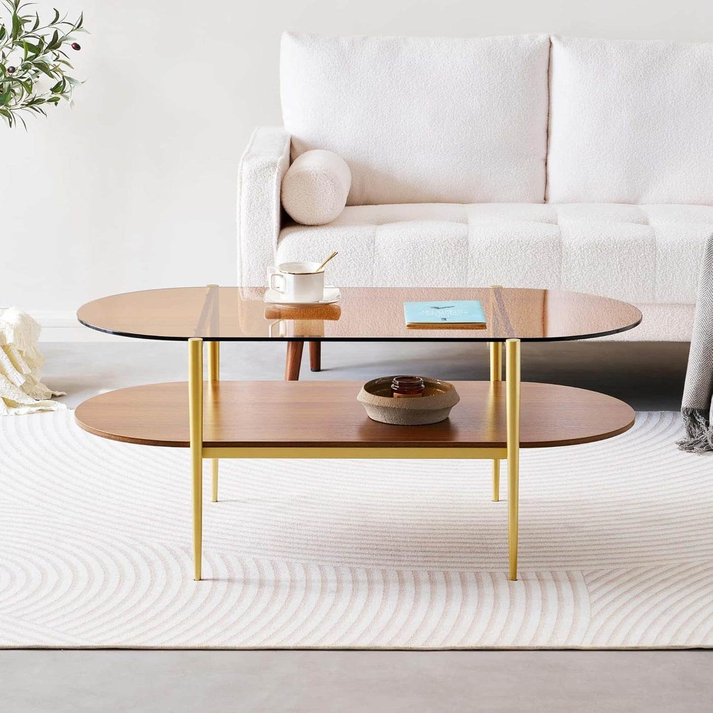 Oval Glass Coffee Table, Mid-Century Modern Design, L41 x W21 x H17 inch, for Living Room, 2-Tier Structure, Amber Glass Top and Walnut Finish Wood Shelf, Conical Legs with Gold Finish Frame