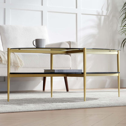 Oval Glass Coffee Table, Mid-Century Modern Design, L43 x W22 x H17 inch, Surfboard Shaped Grey Glass Top and Black Marble Finish Wood Shelf, Tapered Legs with Gold Finish Frame